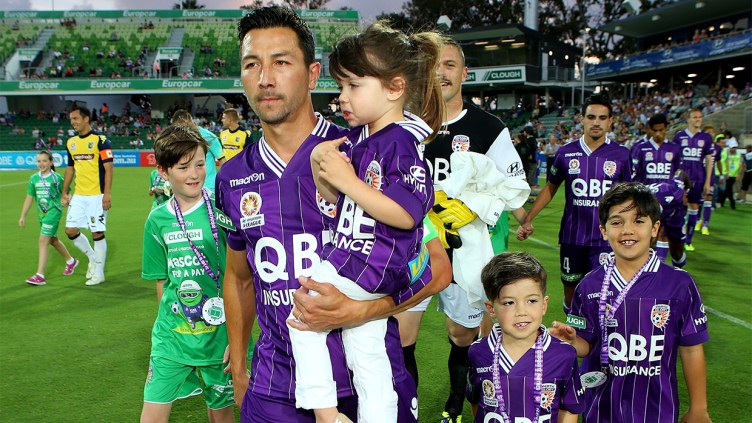 Jacob Burns on pitch with family