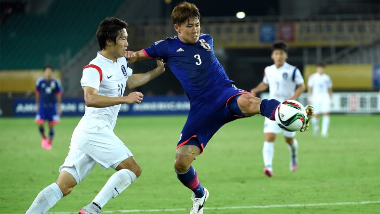 Kosuke Ota - challenging for the ball in Japan game