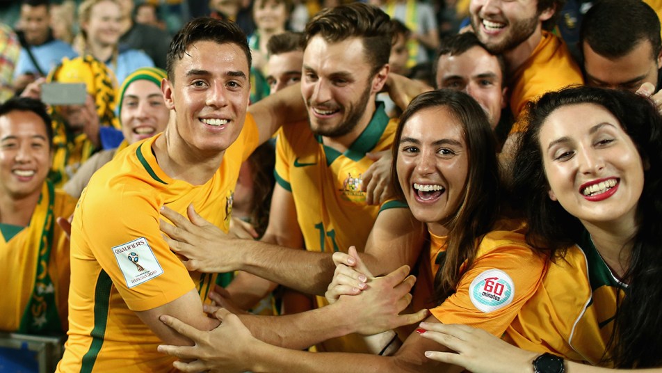 Chris Ikonomdis celebrates with Socceroos fans